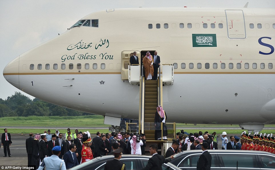 Saudi King Descends From A Golden Escalator